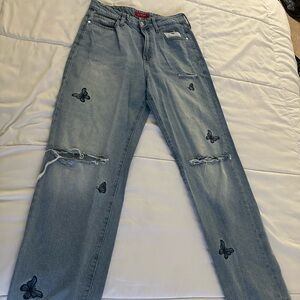 Guess Light Blue Straight Leg Jeans with Black Butterfly Accents